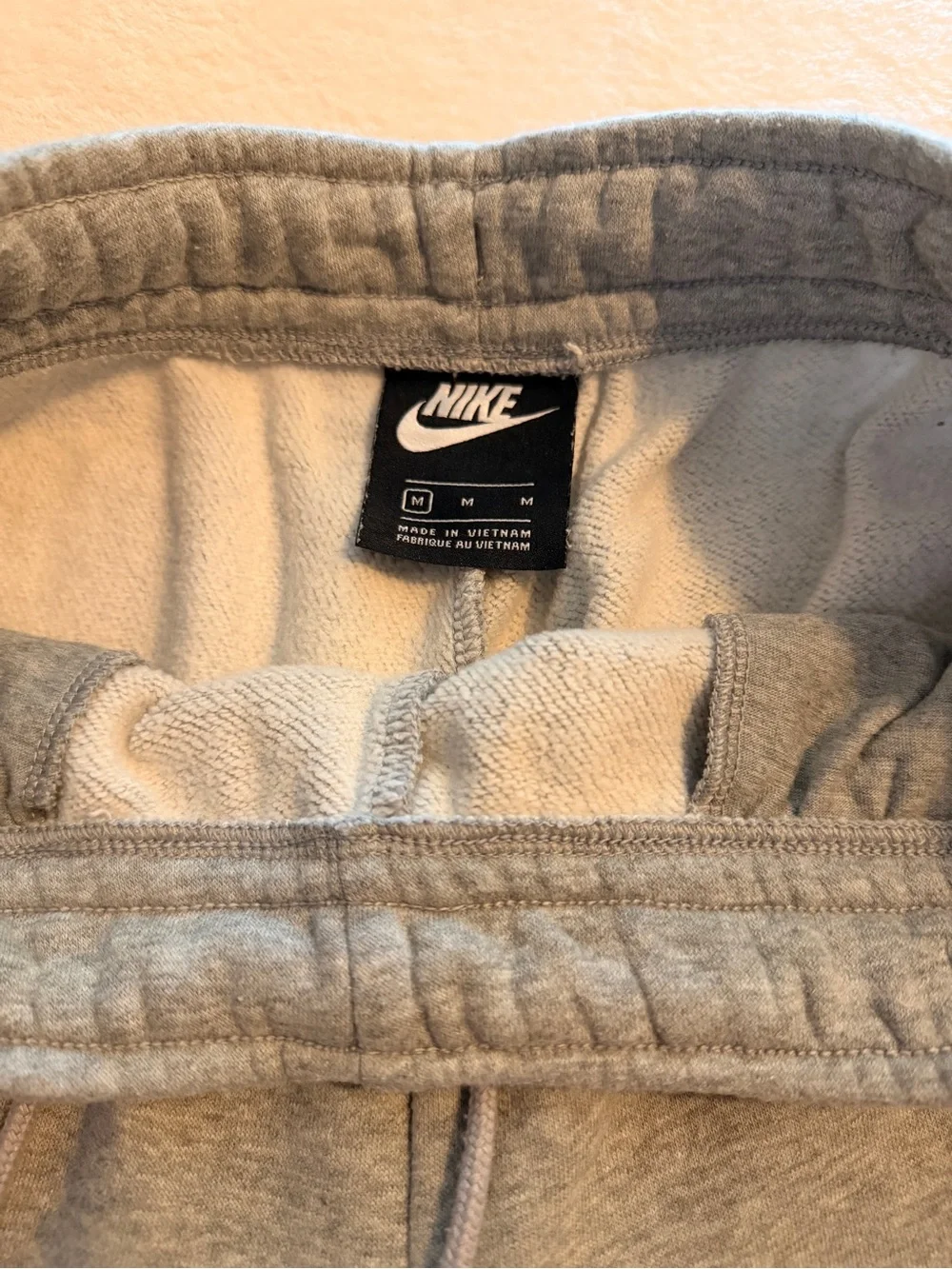 Nike Men's Light Gray Fleece Joggers with White Swoosh